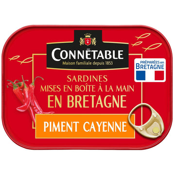 Connetable sardine can with piment cayenne on a red background