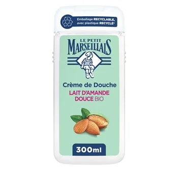A 300ml white plastic bottle of Le Petit Marseillais Crème de Douche (almond milk shower cream) with a light green label, featuring almond illustrations and French text.