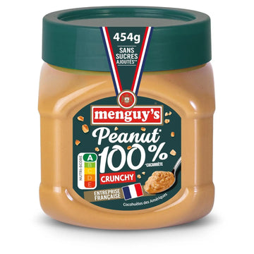 A jar of Menguy's Peanut Butter 100% Cacaoïte Crunchy, 454g, featuring a dark green lid and a label with red, white, and blue accents, set against a plain white background.