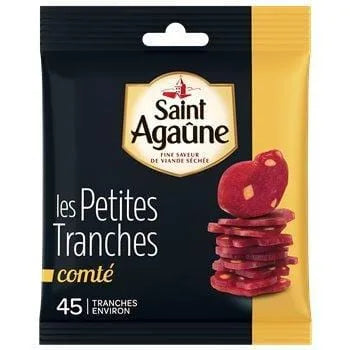 Saint Agaûne Small Slices with Comté 70 g — thin, ready-to-serve slices of lean French dry-cured pork blended with pieces of Comté cheese, arranged in a clear plastic tray showing their rich reddish-brown colour and marbled texture, perfect for charcuterie boards or apéritifs